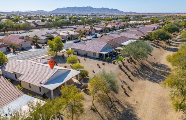 birds eye view of property with a mountain view