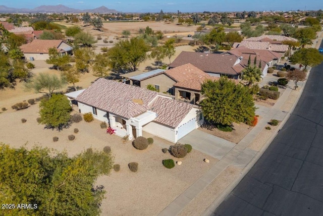 birds eye view of property featuring a mountain view