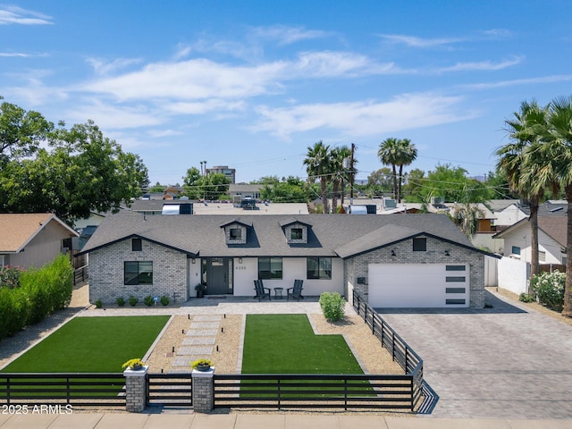 view of front of property with a front lawn, a patio, and a garage