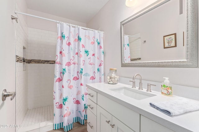 bathroom with a shower with shower curtain and vanity