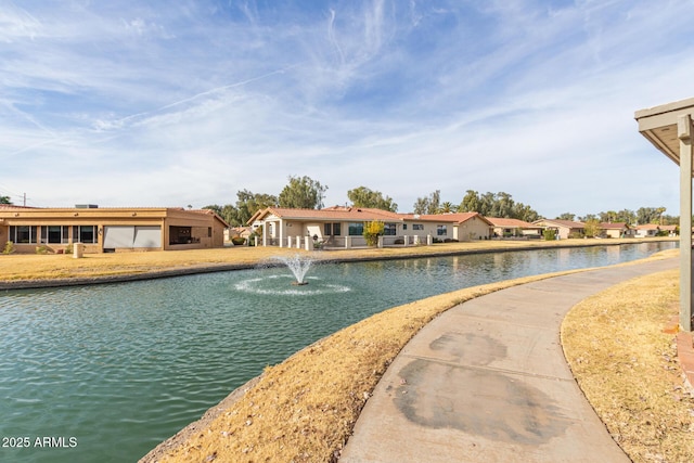 view of swimming pool with a water view