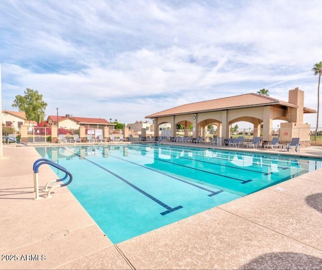 view of swimming pool with a patio area