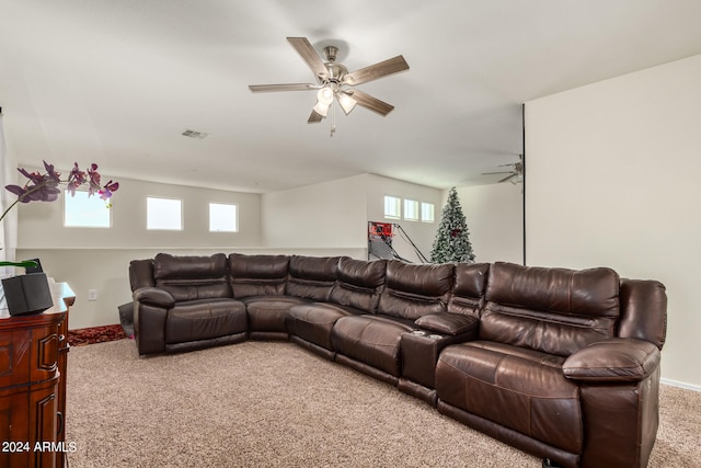 carpeted living room with ceiling fan