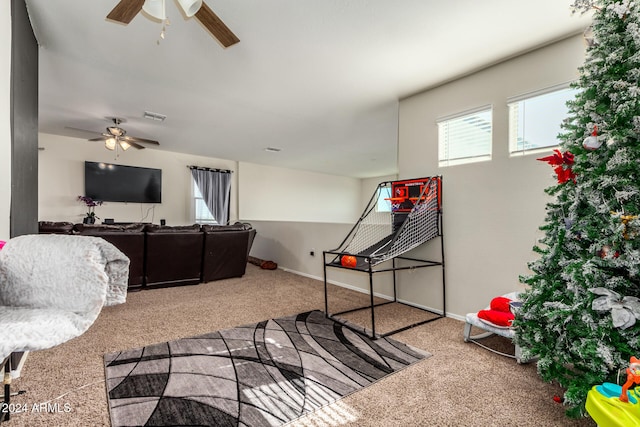 playroom with ceiling fan and carpet floors