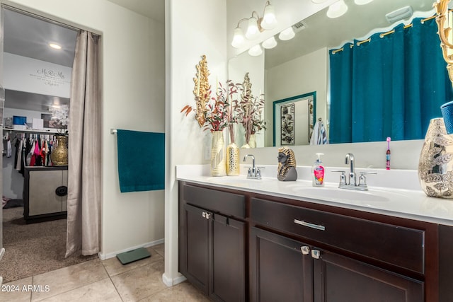 bathroom with vanity and tile patterned flooring