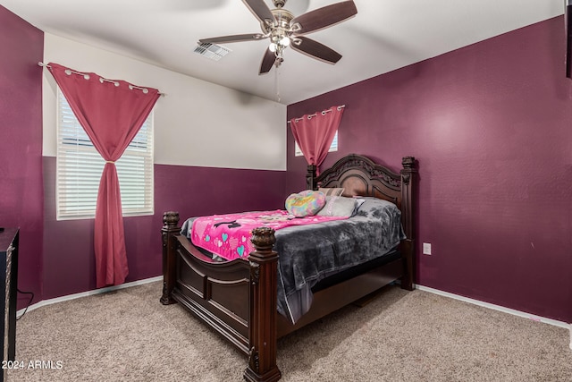 bedroom featuring light carpet and ceiling fan