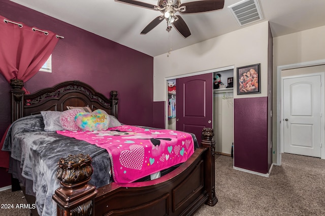 bedroom with a closet, ceiling fan, and light carpet