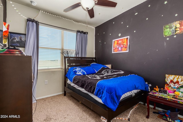 bedroom featuring ceiling fan and light colored carpet