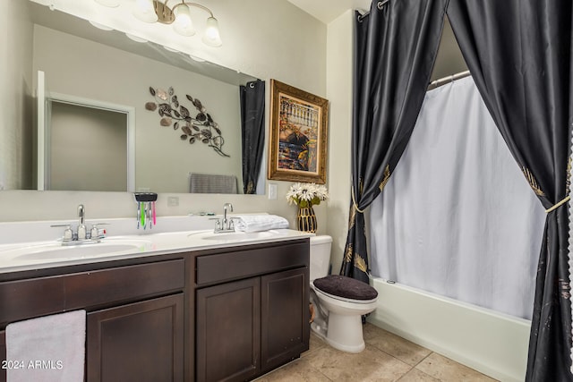 full bathroom with vanity, shower / tub combo with curtain, toilet, and tile patterned flooring