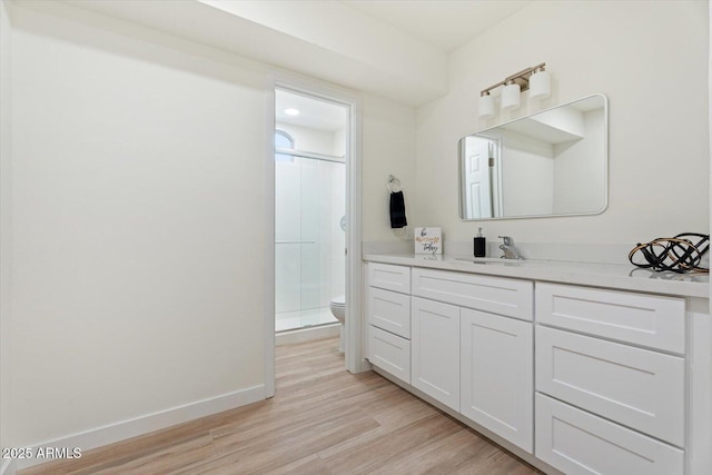 5420 W Grove St, Laveen, AZ 85339 - full bathroom featuring a stall shower, vanity, and wood finished floors