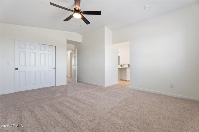 5420 W Grove St, Laveen, AZ 85339 - unfurnished bedroom featuring light carpet, lofted ceiling, ceiling fan, a closet, and connected bathroom