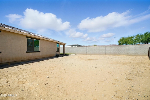view of yard with a fenced backyard