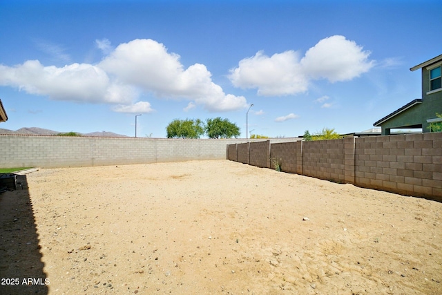 view of yard featuring a fenced backyard