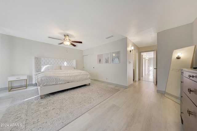 bedroom featuring ceiling fan and light wood-type flooring