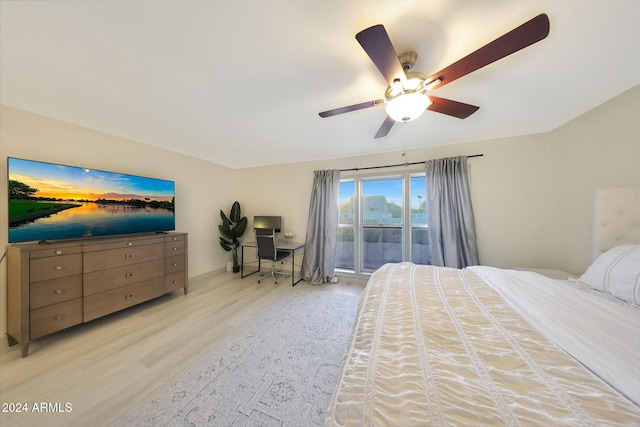 bedroom featuring ceiling fan, access to outside, and light hardwood / wood-style flooring