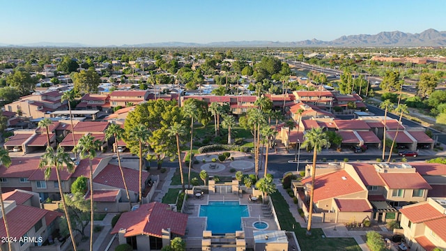 birds eye view of property with a mountain view