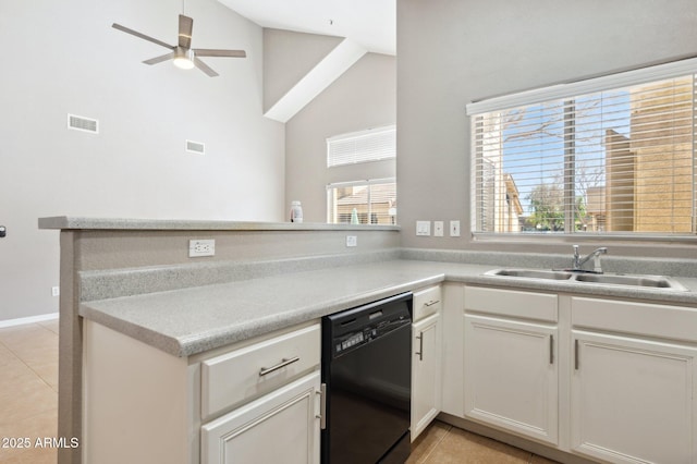 kitchen featuring light tile patterned floors, visible vents, dishwasher, a peninsula, and a sink