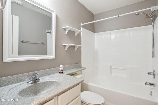 bathroom with toilet, shower / bathing tub combination, and vanity