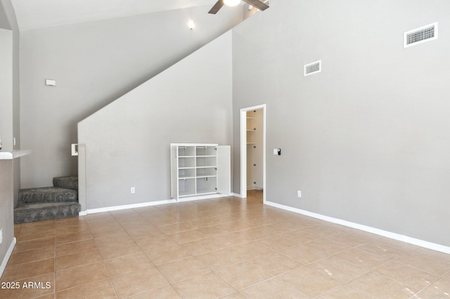 unfurnished living room featuring light tile patterned floors, stairway, visible vents, and a ceiling fan