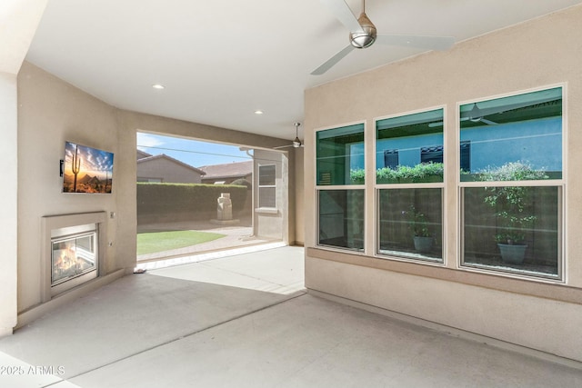 view of patio featuring ceiling fan