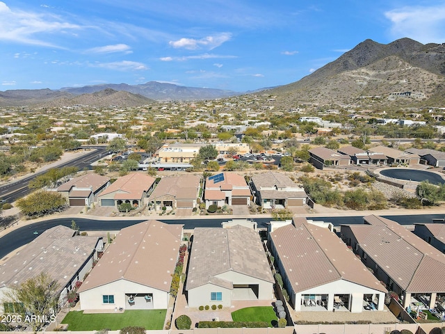 birds eye view of property with a mountain view