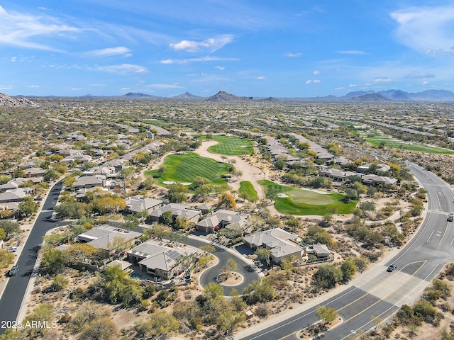 birds eye view of property with a mountain view