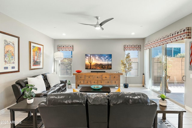 living room featuring ceiling fan and light tile patterned flooring