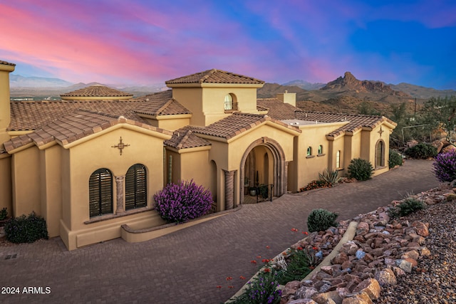 mediterranean / spanish-style home with a mountain view