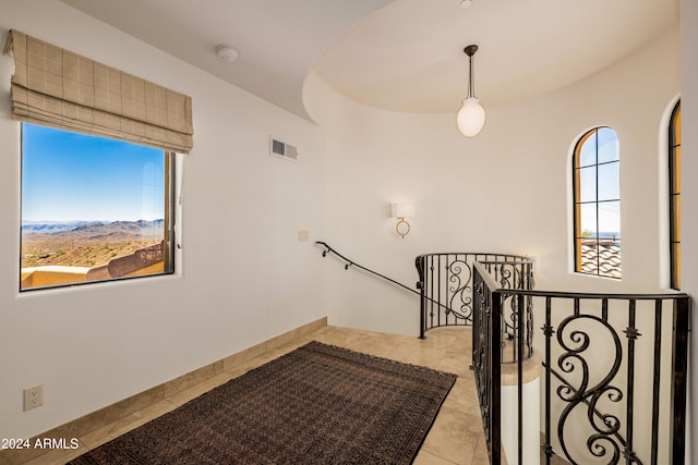 staircase with tile patterned flooring