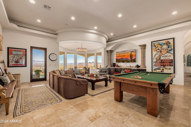 game room with a chandelier and billiards