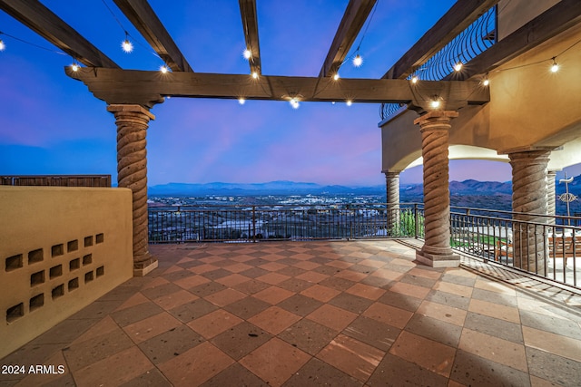 patio terrace at dusk with a mountain view