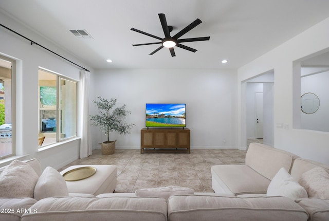 living room featuring baseboards, visible vents, recessed lighting, and a ceiling fan