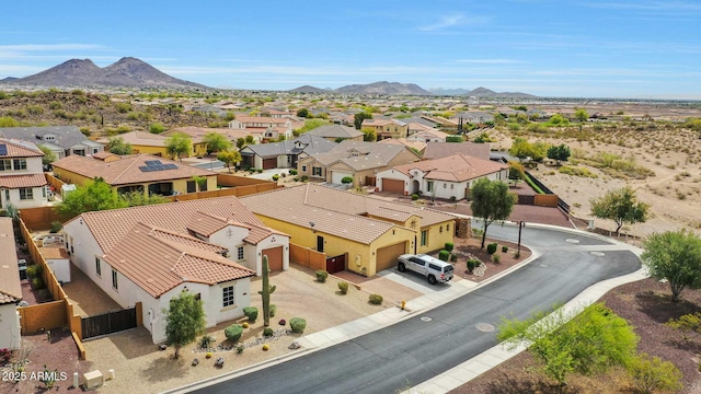 drone / aerial view with a residential view and a mountain view