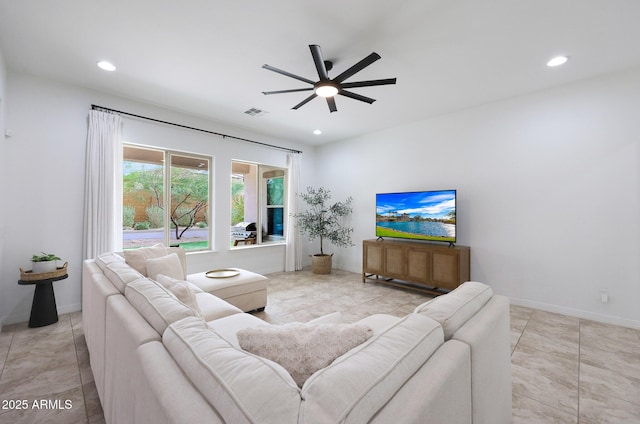 living area featuring tile patterned flooring, baseboards, visible vents, ceiling fan, and recessed lighting