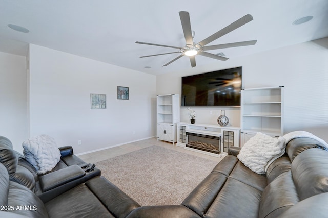 living room featuring ceiling fan and light tile patterned floors