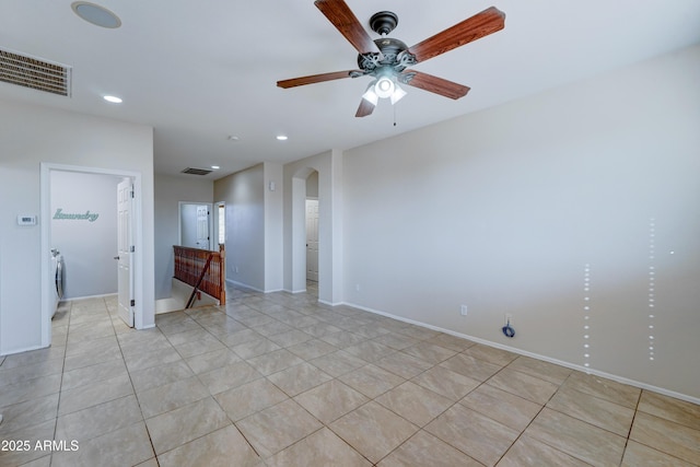 unfurnished room with ceiling fan and light tile patterned flooring