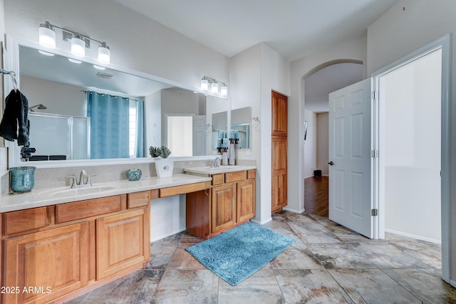 bathroom with vanity and an enclosed shower