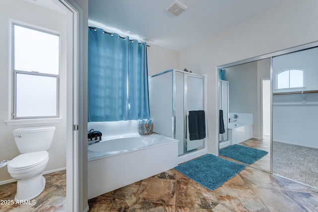 bathroom with separate shower and tub and toilet