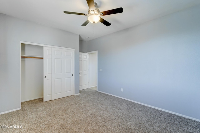 unfurnished bedroom featuring ceiling fan and light colored carpet