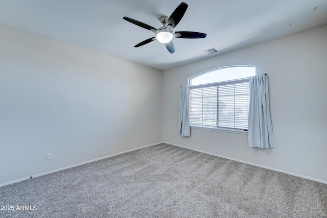 carpeted empty room with ceiling fan