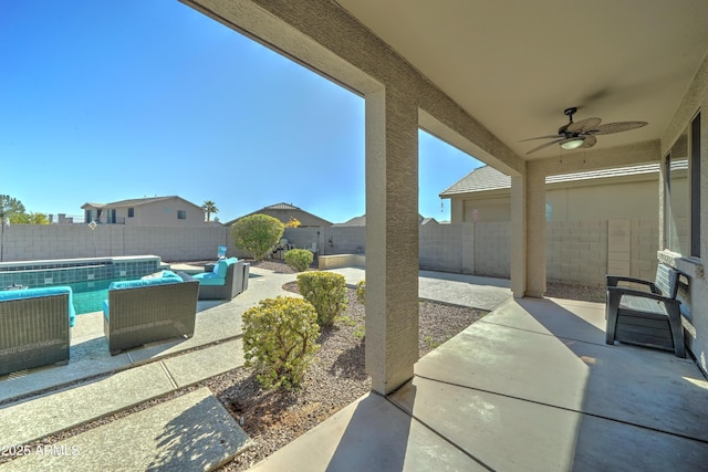 view of patio / terrace with ceiling fan, an outdoor living space, and a fenced in pool