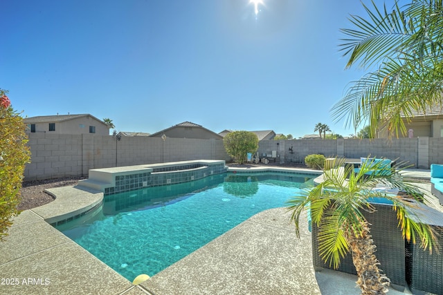 view of swimming pool with an in ground hot tub