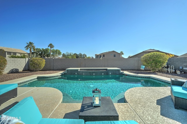 view of pool with an in ground hot tub and a patio