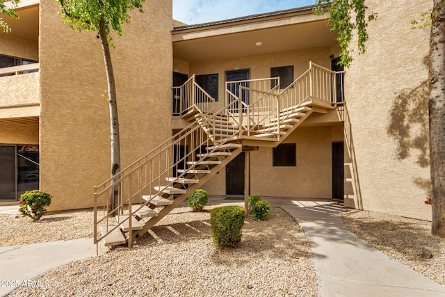 view of property featuring stairs