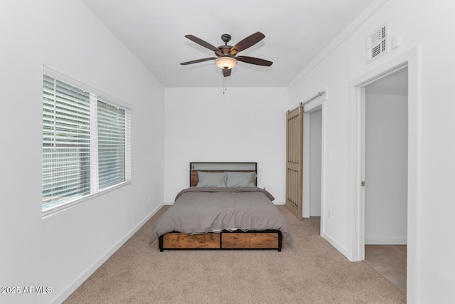 bedroom with carpet floors, baseboards, ceiling fan, and visible vents
