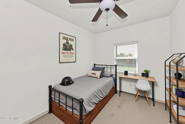 bedroom featuring baseboards, carpet flooring, and a ceiling fan