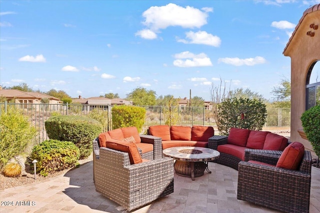 view of patio / terrace featuring an outdoor living space with a fire pit