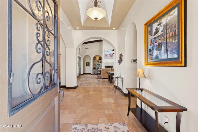 entryway featuring a tray ceiling