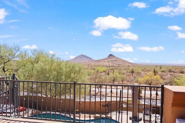 balcony featuring a mountain view