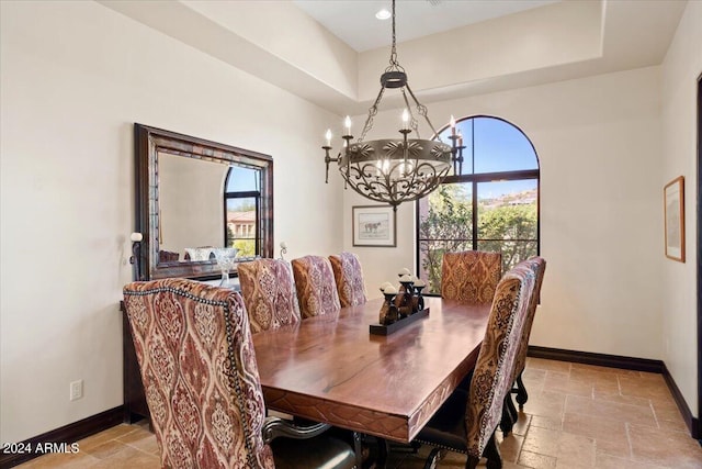 dining space featuring an inviting chandelier